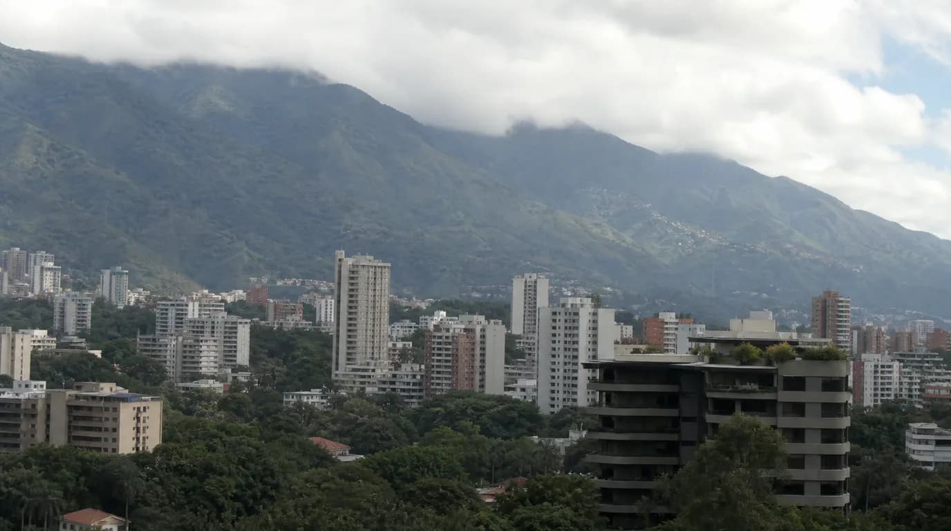 View of different residential neighborhoods of Caracas across the valley, with apartment buildings at the foot of El Ávila